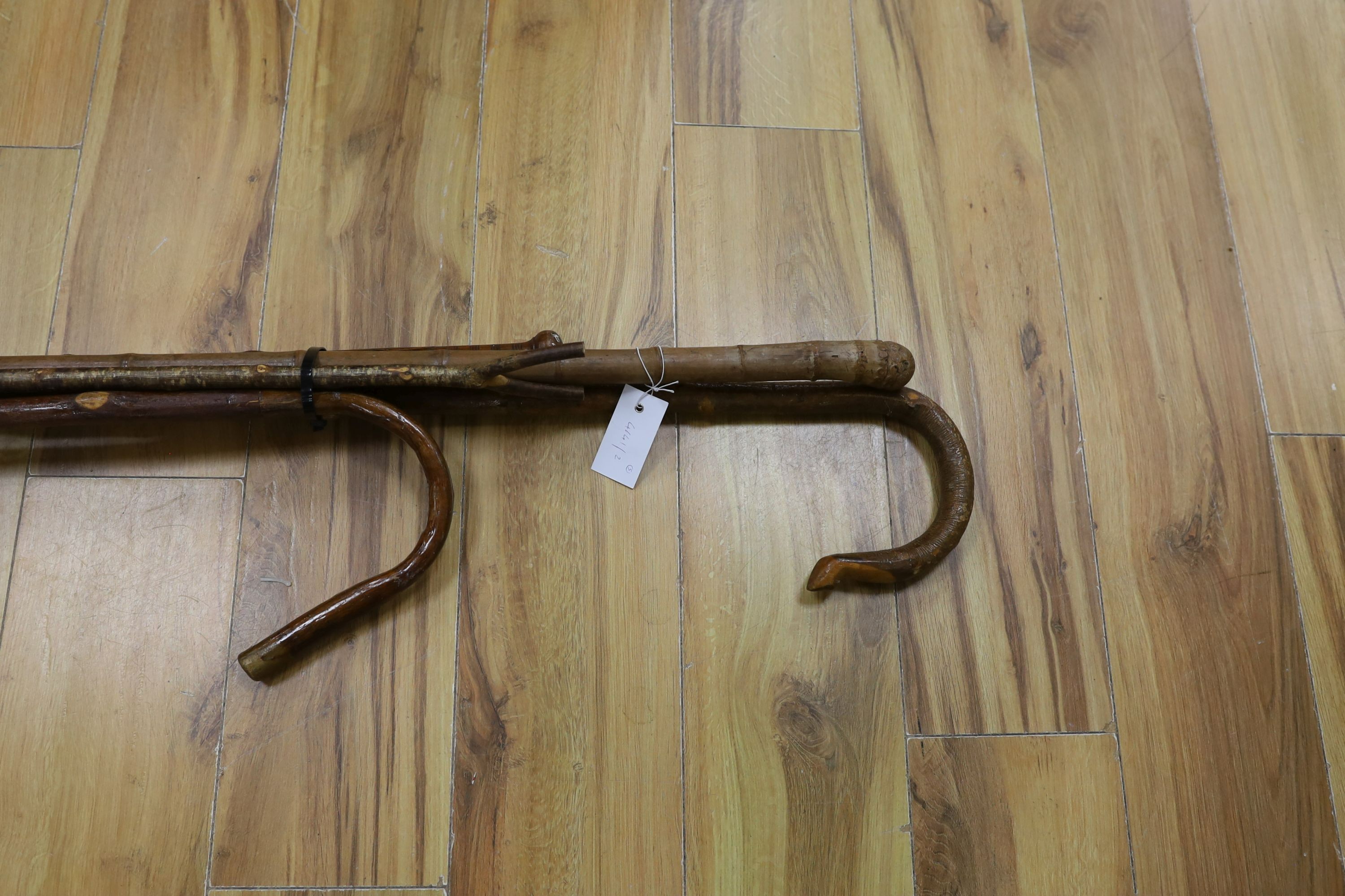A collection of 5 walking sticks/Shepard's crooks